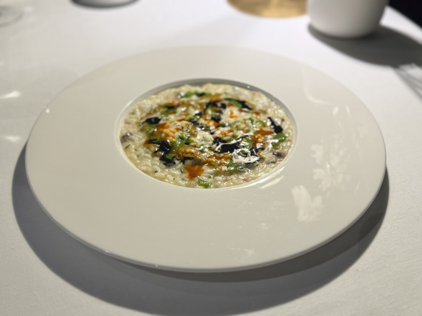 Risotto riviera Adriatica (mantecato in tre salse, brodetto, cozze e alghe).