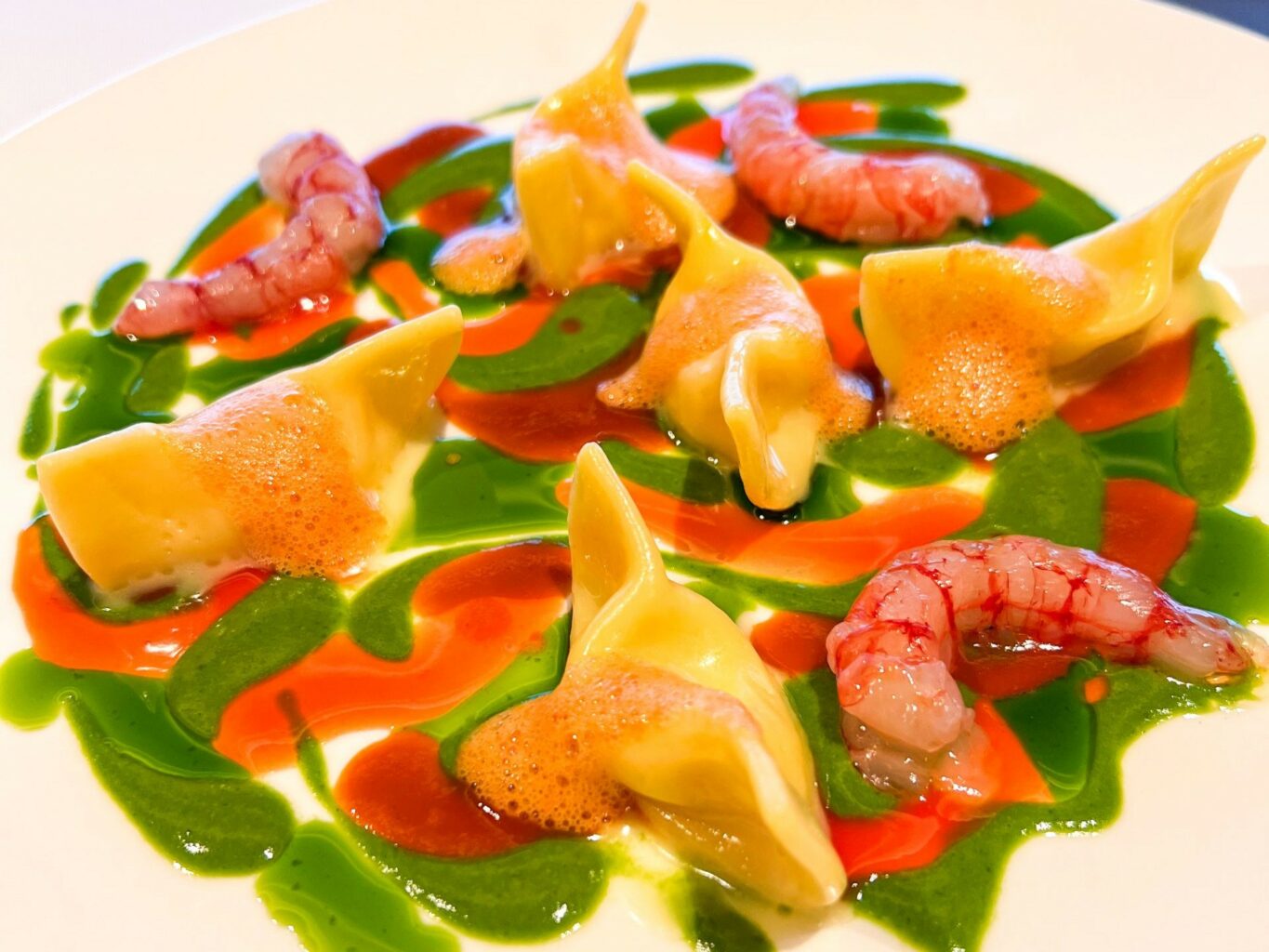 Casoncello di mare, gambero rosso; arancia sanguigna e la sua bisque.