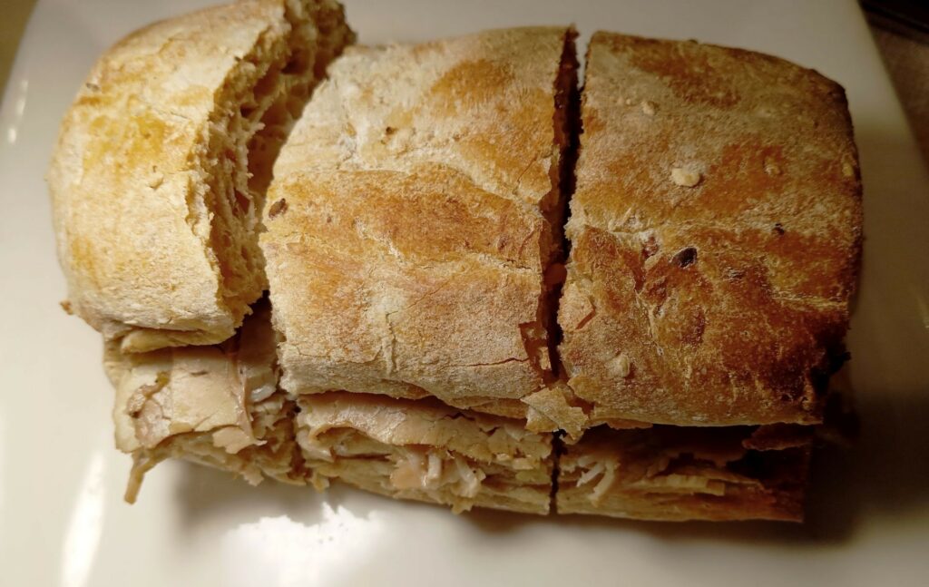 Mpustarelle con ventresca di maiale, fiordilatte di Agerola e pepe.