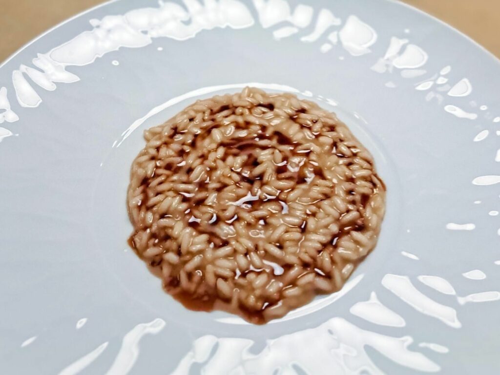 Risotto alla cipolla caramellata e ristretto di arrosto.