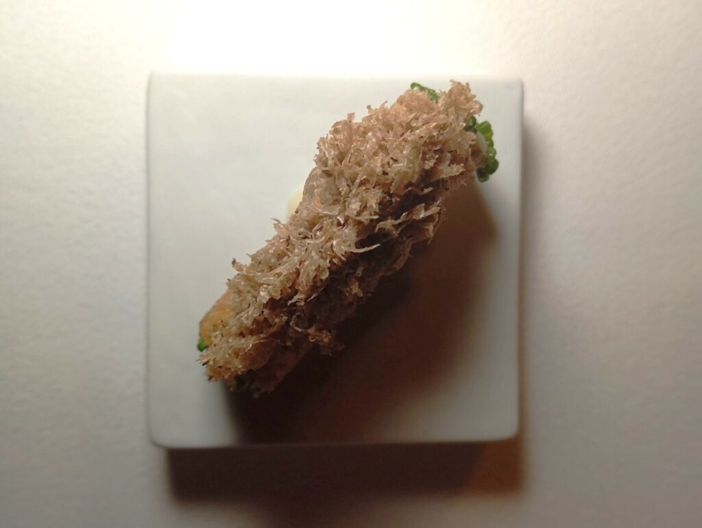 Cannolo ripieno di patate con tartufo nero