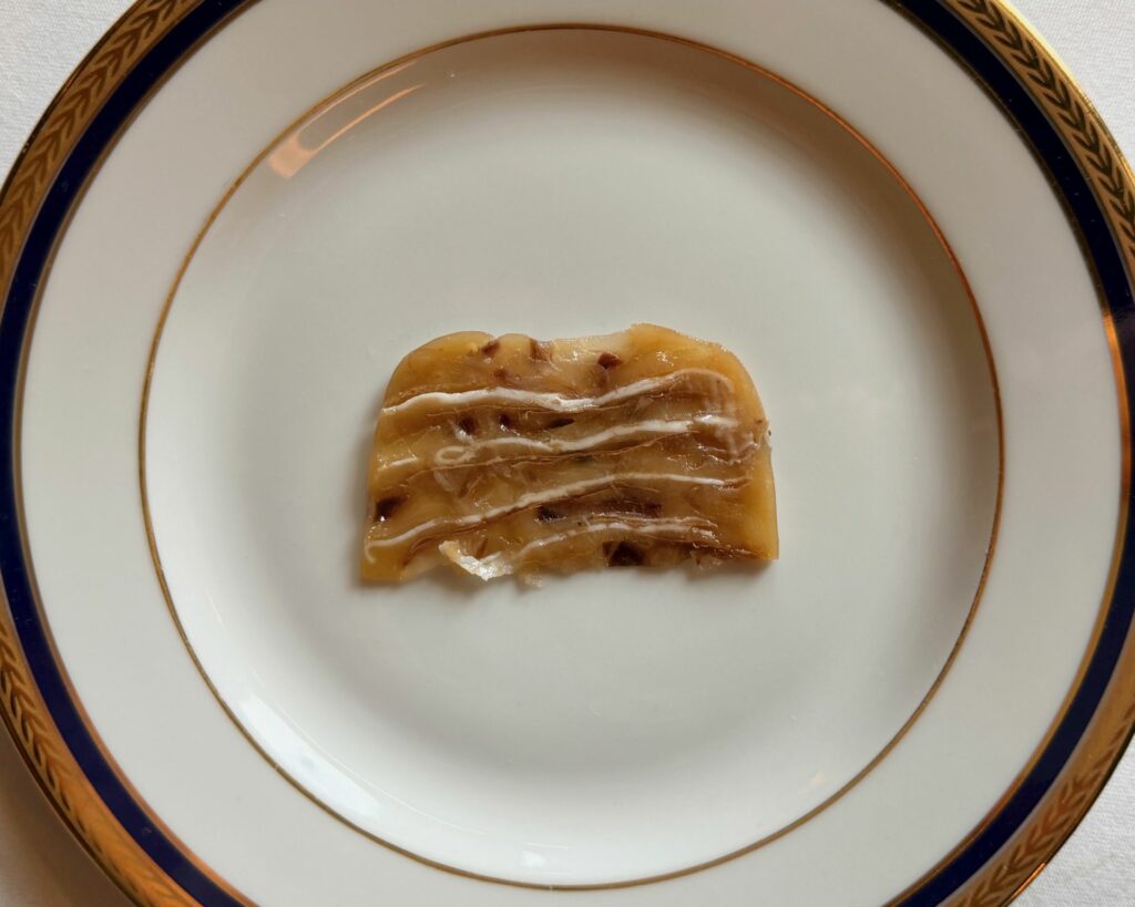 Terrina di champagne Taittinger, branzino e lardo