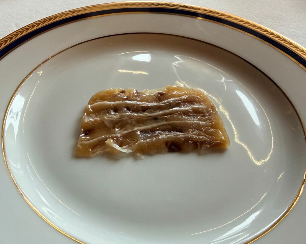 Terrina di champagne Taittinger, branzino e lardo di Maison ruggieri