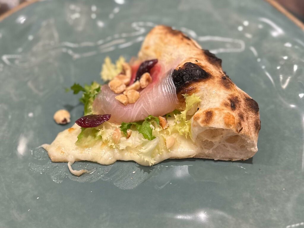 Trancio di Cesarella: fior di latte, ciliegie fermentate, ricciola, scarola e nocciole di Sasà martucci