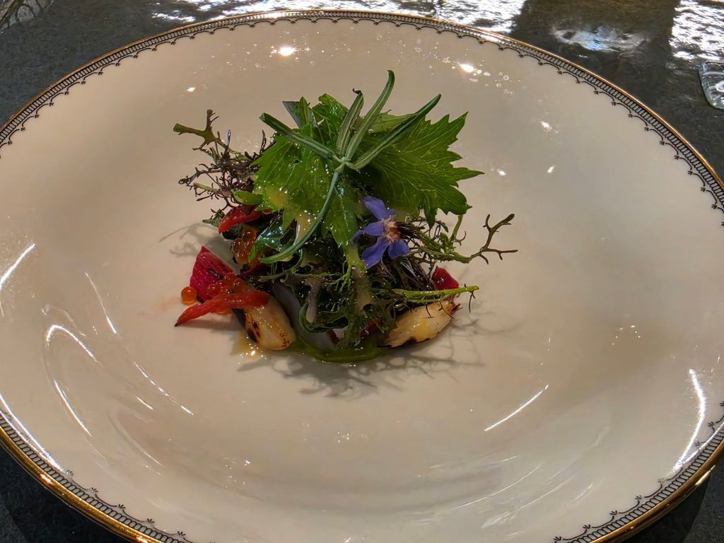 Insalata: primizie di Orto Felice crude e cotte, storione, pomodori confit, aneto, vingrette al wasabi.